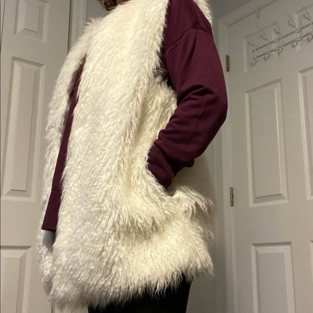 Super soft shaggy vest with pockets.